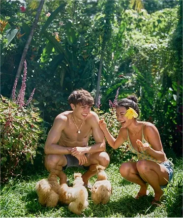 On Kelly (left) : Men's Swim Shorts / Navy Blue, On Ashley (right) : Holly Tankini Top / Agua Fresca